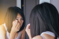 Asian woman cleaning her eye with tissue,Female itching to her eyes Royalty Free Stock Photo