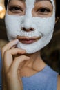 Asian Woman With Cleansing Mask On Her Face At Home. Skin Care. Royalty Free Stock Photo