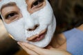 Asian Woman With Cleansing Mask On Her Face At Home. Skin Care. Royalty Free Stock Photo