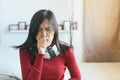 Asian woman coughing with sore throat,Female suffering with cough a lot in bedroom