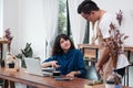 Asian woman customer complaining to waiter about food in cafe re Royalty Free Stock Photo