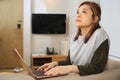Asian woman deep thought when using laptop Royalty Free Stock Photo