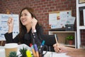 Asian woman delighted when she understood the documents in the library