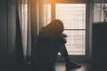 Asian woman depression have a headache of lonely in bedroom,Black and white toned Royalty Free Stock Photo