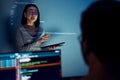 asian woman developers collaborating on a coding project, with one member presentation at code projected on the wall while the Royalty Free Stock Photo