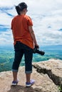 Asian woman with digital camera, outdoor at the daytime on summer day. Royalty Free Stock Photo