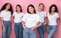 Asian Woman With Diverse Ladies Standing Over Pink Background
