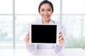 Asian woman doctor showing digital tablet screen Royalty Free Stock Photo