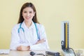 Asian woman doctor with smiling face sit in office at hospital Royalty Free Stock Photo