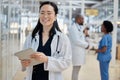 Asian woman, doctor with tablet and portrait smile in hospital for healthcare, telehealth and research. Medical Royalty Free Stock Photo