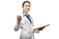 Asian woman doctor in a white lab coat and stethoscope holding the clipboard and using pen Royalty Free Stock Photo