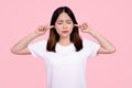 Asian woman She doesn`t want to hear. She covered her ear with her hand Royalty Free Stock Photo