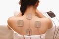 Asian woman is doing massage of electrical -stimulation ( TENs ) Royalty Free Stock Photo