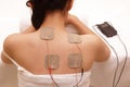 Asian woman is doing massage of electrical -stimulation Royalty Free Stock Photo