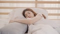 Asian woman dreaming while sleeping on bed in bedroom, Beautiful japanese female using relax time lying on bed at home. Lifestyle Royalty Free Stock Photo