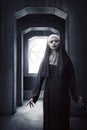 Asian woman dressed in evil nun standing Royalty Free Stock Photo