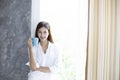 Asian women drinking coffee and wake up in her bed fully rested Royalty Free Stock Photo