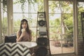 Asian woman drinking cool green tea beverage in cafe