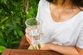 Asian woman drinking glass of water in cafe outdoor. Enjoy moment and stay hydrated. Healthy mindfulness self care eating habits Royalty Free Stock Photo