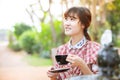 Asian woman drinking hot tea in the summer morning outdoor good feeling and relax day Royalty Free Stock Photo