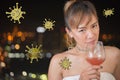 Asian woman drinking makes you more vulnerable to Covid-19 and other communicable diseases Royalty Free Stock Photo