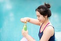 Asian woman drinking sport drink after doing pilates exercise Royalty Free Stock Photo