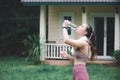 Asian woman drinking water on front yard after jogging  healty and sport concept Royalty Free Stock Photo