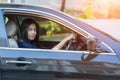 Asian woman driving her car. Royalty Free Stock Photo