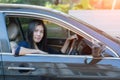 Asian woman driving her car. Royalty Free Stock Photo