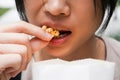 Asian woman easting popcorn full hand closed up Royalty Free Stock Photo