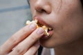 Asian woman easting popcorn full hand closed up Royalty Free Stock Photo