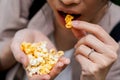 Asian woman easting popcorn full hand Royalty Free Stock Photo