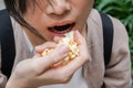 Asian woman easting popcorn full hand Royalty Free Stock Photo