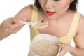 Asian woman eating bowl of cereal or muesli for breakfast Royalty Free Stock Photo