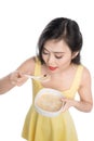 Asian woman eating bowl of cereal or muesli for breakfast Royalty Free Stock Photo