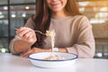 A woman eating carbonara spaghetti Royalty Free Stock Photo