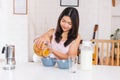 Asian woman eating cereal breakfast on kitchen table in morning.daily lifestyle Royalty Free Stock Photo