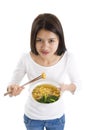 Asian woman eating with chop sticks