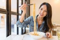 Asian Woman eating noodles in chinese restaurant Royalty Free Stock Photo