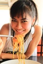 Asian woman eating spaghetti Royalty Free Stock Photo