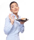 Asian woman eating sushi. Shallow depth of field, focu