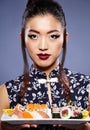 Asian woman eating sushi, Royalty Free Stock Photo