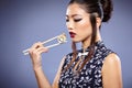 Asian woman eating sushi, Royalty Free Stock Photo