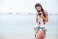 Asian woman enjoy take photo by digital camera at beach. Single and lonely woman concept. Happiness and Lifestyle concept. Beauty Royalty Free Stock Photo