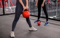 Asian woman exercise and lifestyle at fitness gym. Sporty woman workout with trainer and dumbbell weight. Wellness and healthy Royalty Free Stock Photo