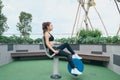 Asian woman exercising at outdoors gym playground equipment Royalty Free Stock Photo