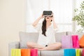 Asian woman experience shopping online with VR headset