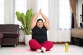 Asian woman fat exercising and practice yoga at home Royalty Free Stock Photo