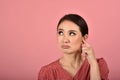 Asian woman feeling upset and frustrated, Girl rolling eyes with boredom and annoy about gossip. Royalty Free Stock Photo