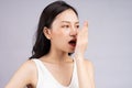 Asian woman feels uncomfortable because of bad breath